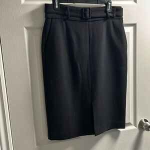 Midi length, belted skirt with side pockets